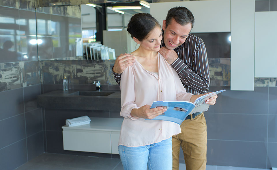 Mood Kitchens Showroom POS - Couple reading brochure